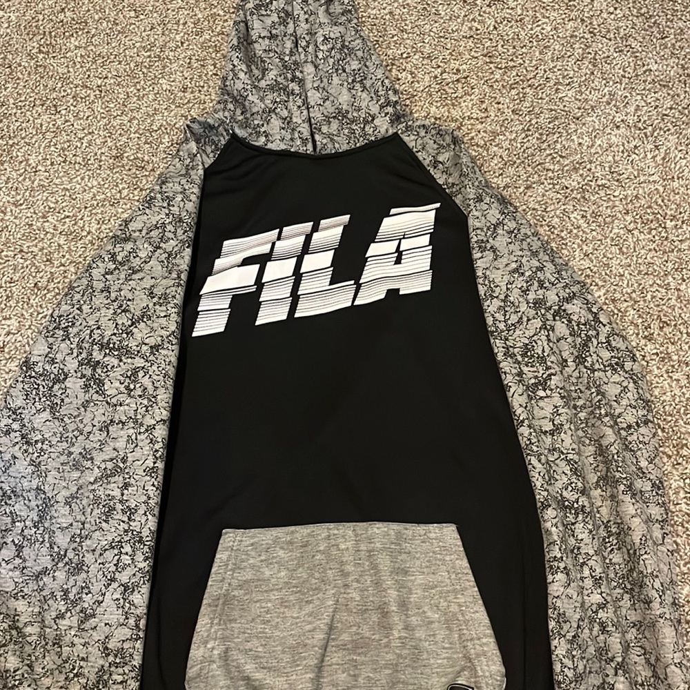 I am selling a Fila black gray and white barely used size 14 - 16 hoodie.